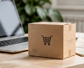 Krabice s ikonou košíku vedle notebooku